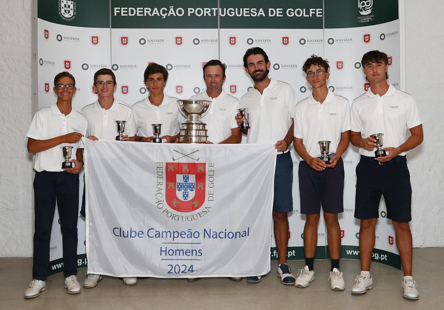 Vilamoura Golf Club team celebrating their 18th national title in the Men's National Club Championship, holding trophies and a banner, 2024.