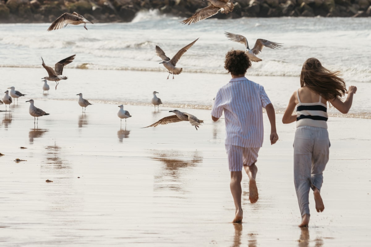 kids running in vilamoura beach